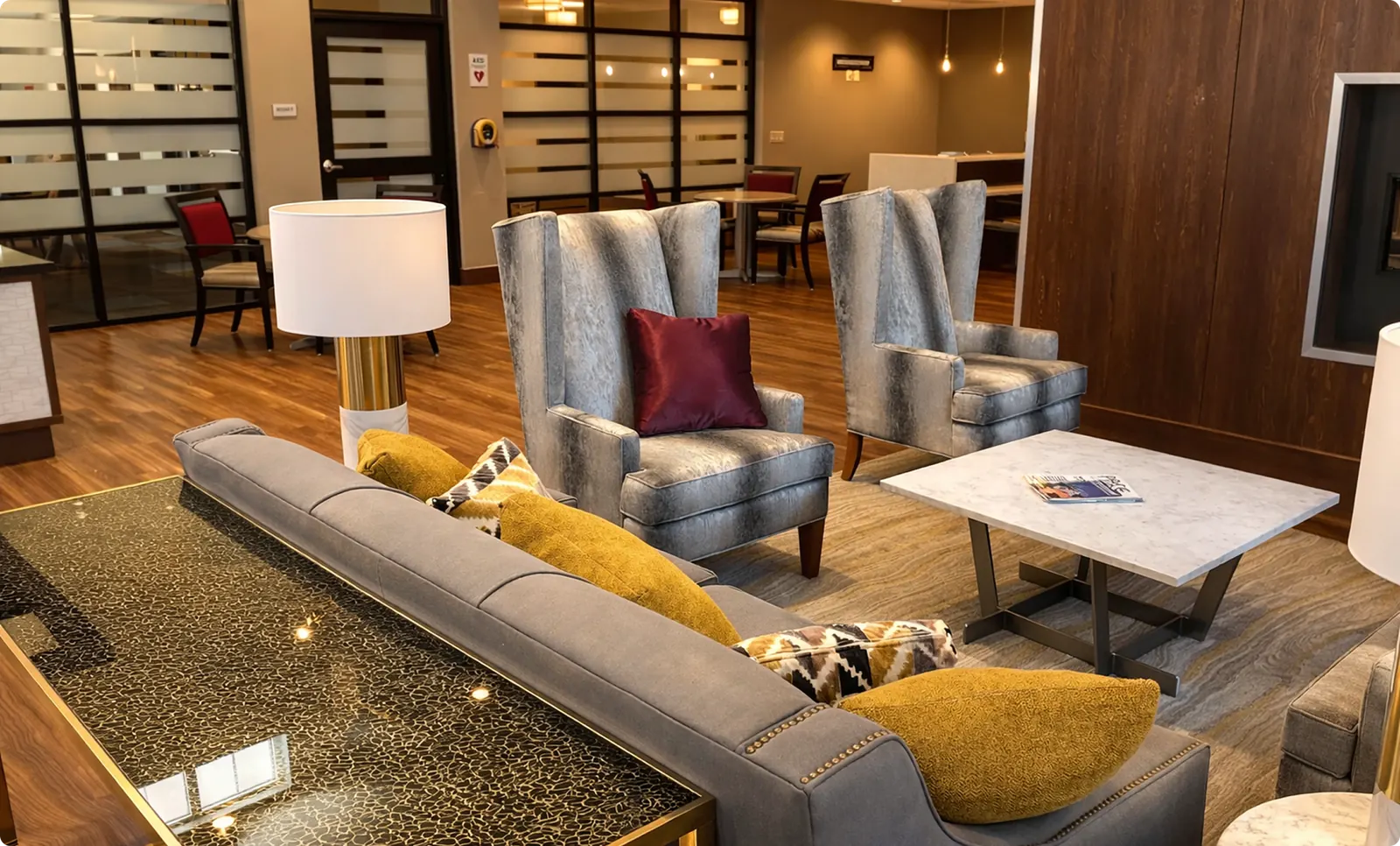 A resident commons area with seating clusters and storage
