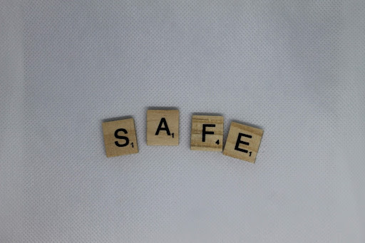 Scrabble letters spelling the word "safe".